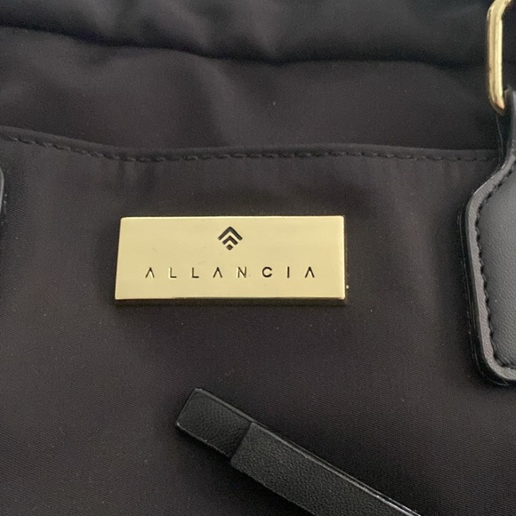 Black backpack with multiple pockets, luggage handle sleeve - Picture 3 of 4